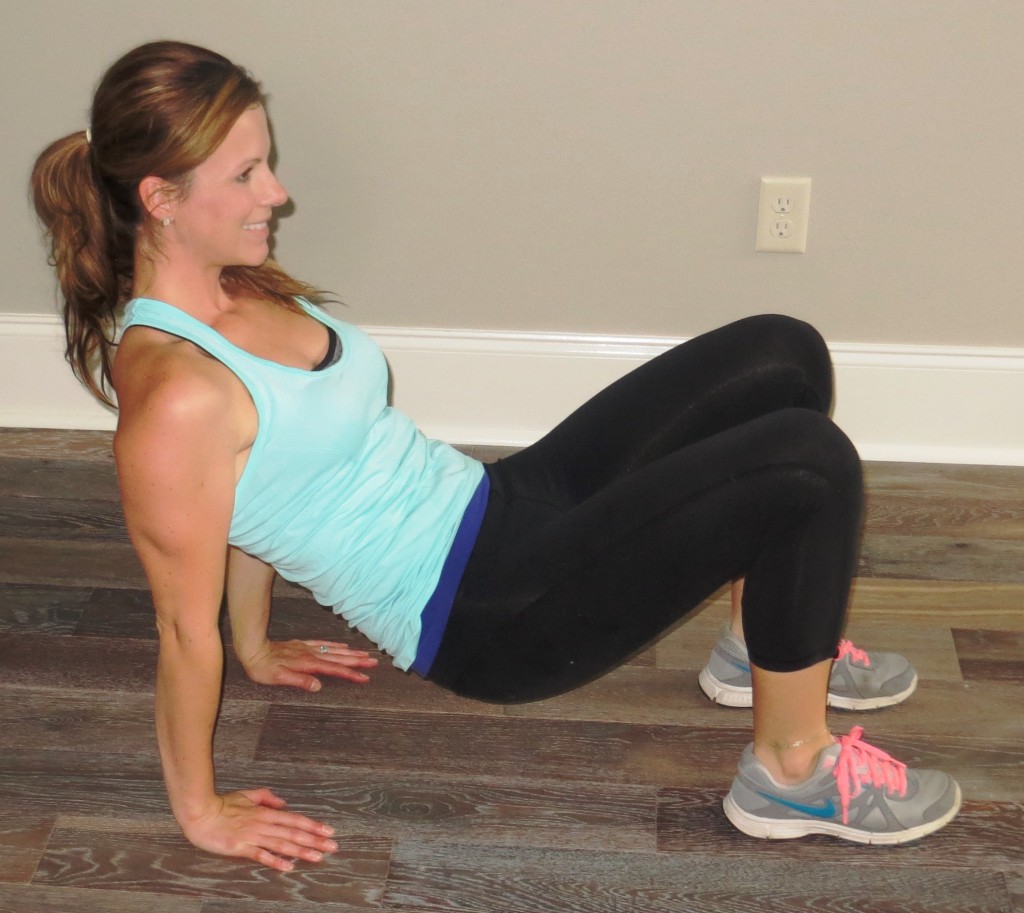 Starting on the ground with your knees bent, use your triceps to lift your hip about 6 inches off the ground. 