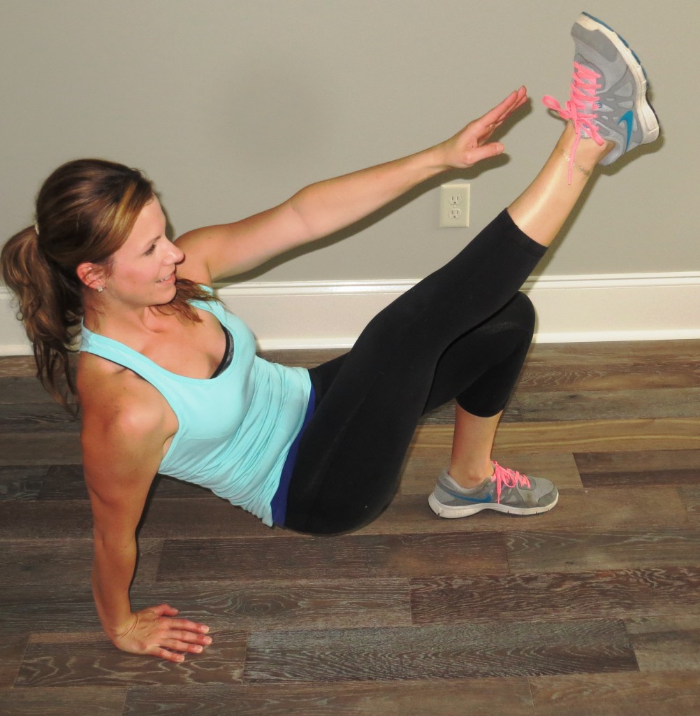 Once your hips are lifted off the ground, you're going to kick your leg up and reach to your toes with the opposite arm. For this exercise, I recommend alternating sides. 