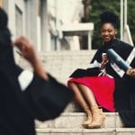 woman-wearing-black-graduation-coat-sits-on-stairs-901962 (1)