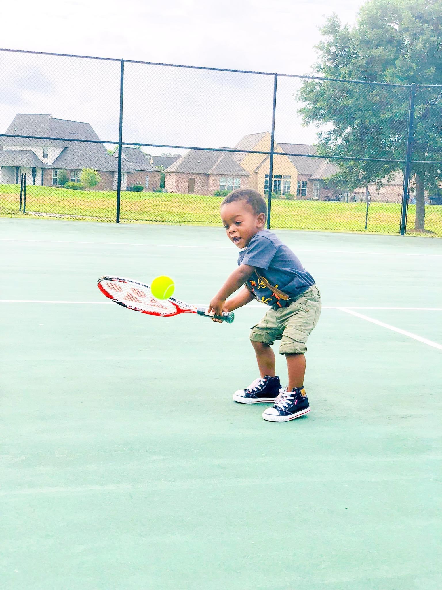 Kid playing tennis